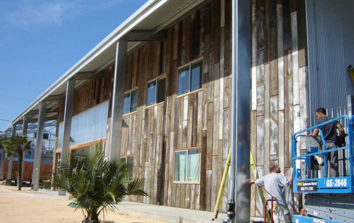 Unique metal building with reclaimed wood siding