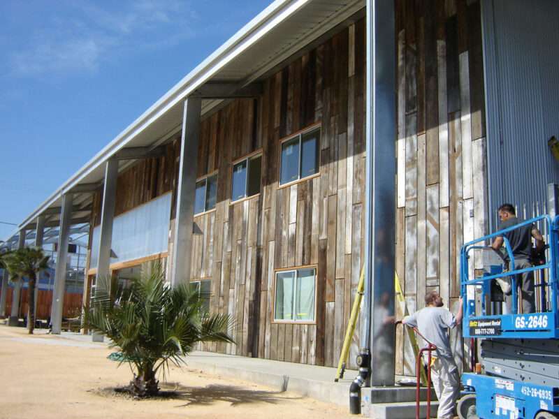 Unique metal building with reclaimed wood siding