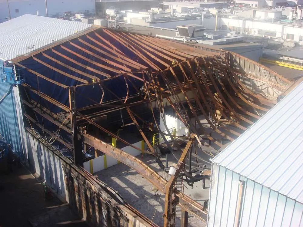 damaged-metal-building-steel-frame Repairs on a metal building after a fire