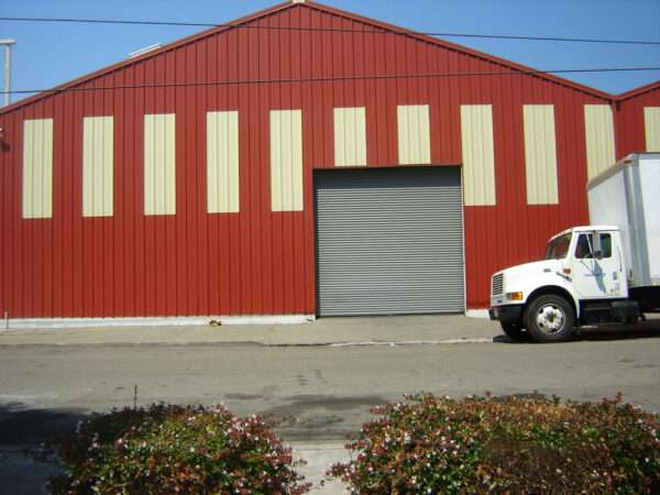 red metal siding and rolling door