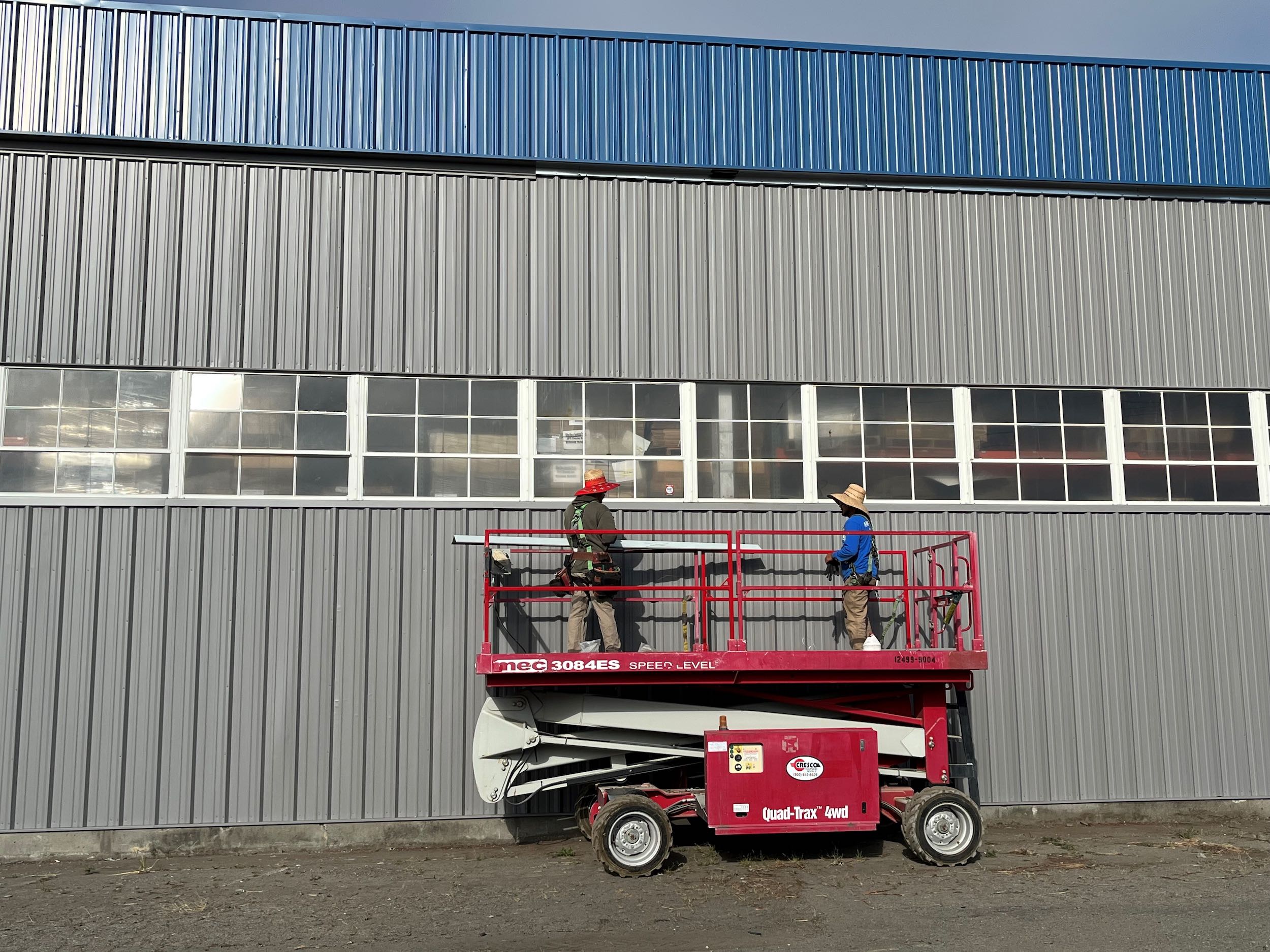 Polytek Siding with Crew Polytek steel siding being installed
